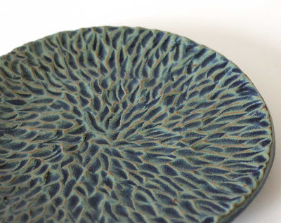 glazed carved pottery plate
