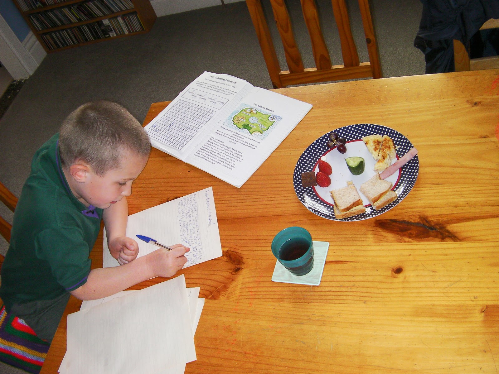 cub scout doing school homework on dining table afternoon snack with perseus and mythical creatures homework project