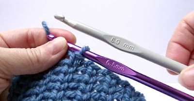Use a much larger crochet hook