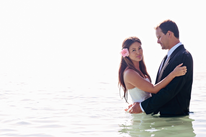 Gorgeous bride and groom in the ocean by STUDIO 1208