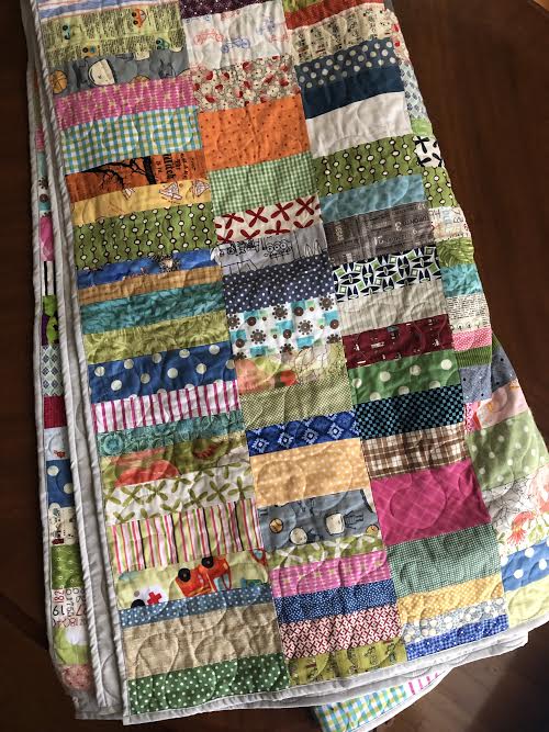 a maiden hair fern scrappy strip quilt