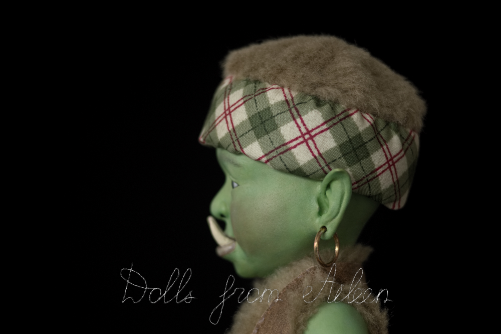 ooak artist baby orc doll's face in profile