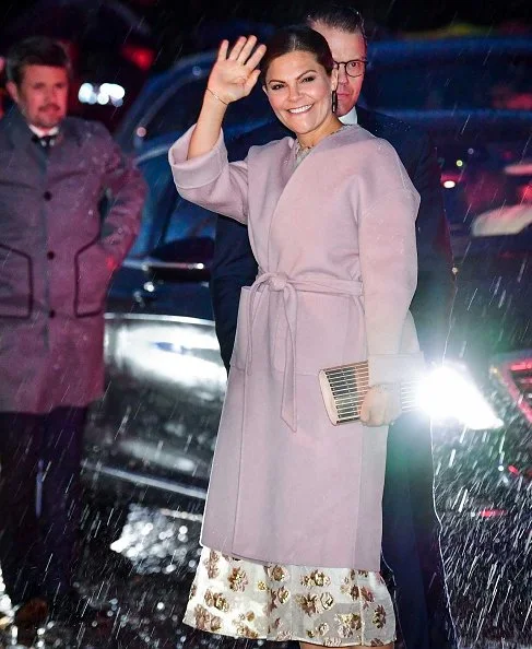 Crown Princess Victoria wore MaxMara pink Lilia cashmere wrap coat. Crown Princess Mary wore a Ralph Lauren dress