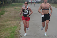 #288 Katie Showman (21st, 49:52) one turn and one straightaway before claiming the women's title in the Gulf Winds Track Club's 2012 Flash 12K. Katie Showman