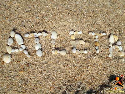 Atleta - letras com pedras da praia