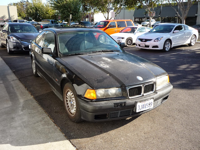 1994 BMW 325iS with peeling paint before repairs at Almost Everything Auto Body