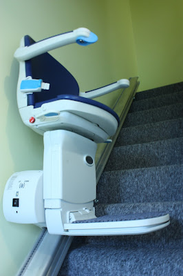 This shows the stair lift, part way up the stairs