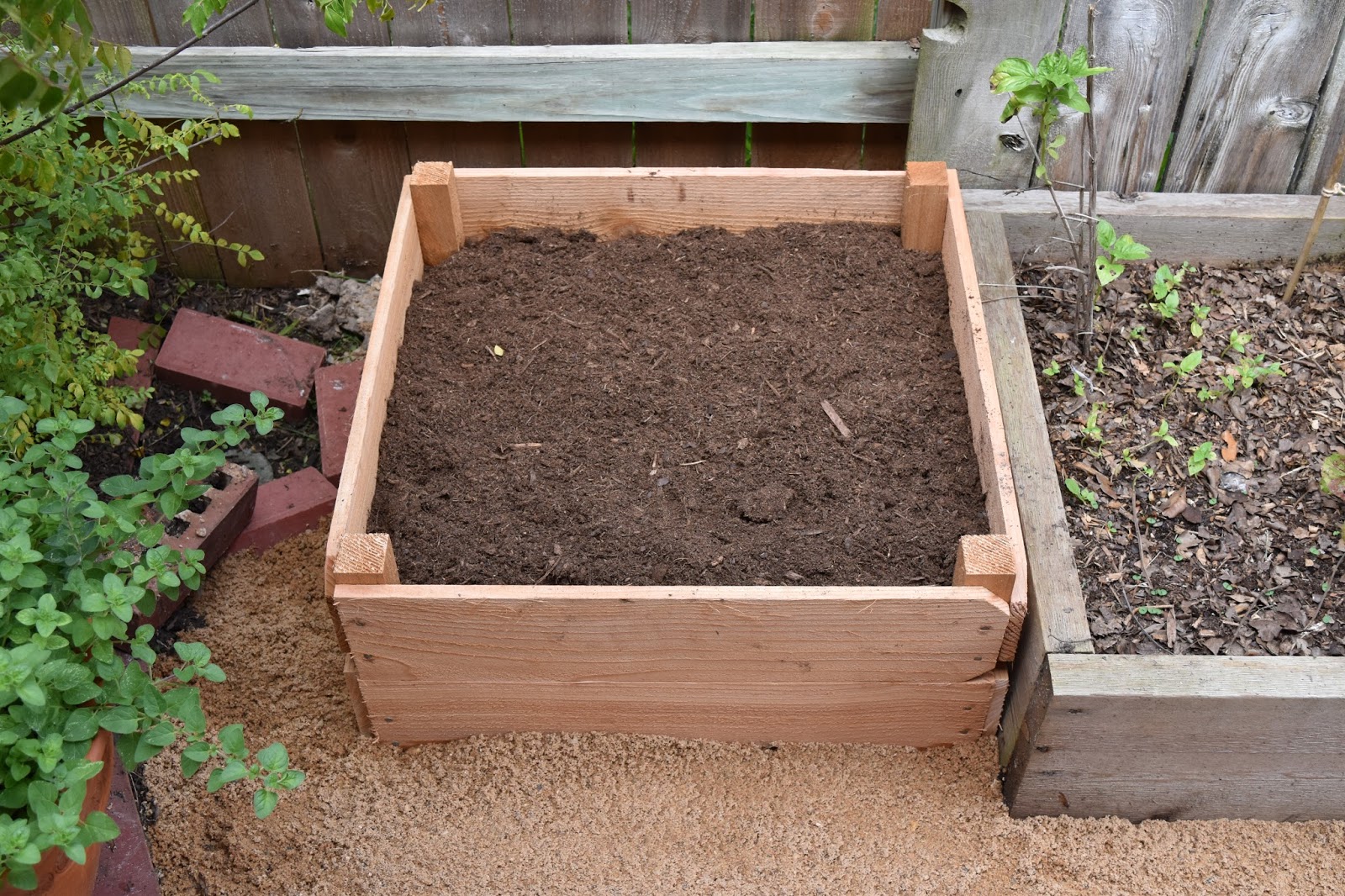 Veena Chimes Raised Beds With Cedar Pickets