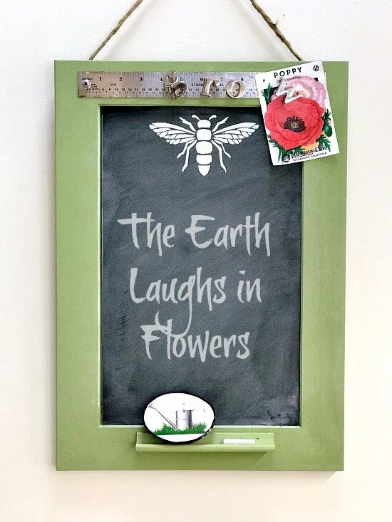 green chalkboard with magnetic ruler