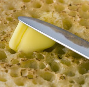 Spreading butter Spreading butter on a crumpet