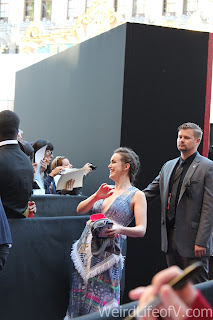 Captain America: Civil War Red Carpet World Premiere Elizabeth Henstridge posing for a fan's camera