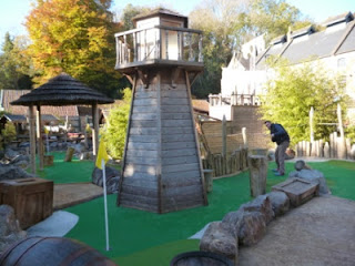Richard Gottfried playing the 7th hole at Pirate Island Adventure Golf at Wookey Hole