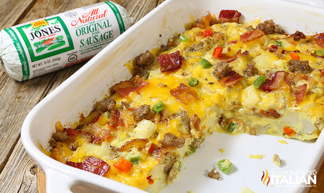 Cheesy Breakfast Casserole breakfast casserole with bacon, sausage, and cheese in white baking dish