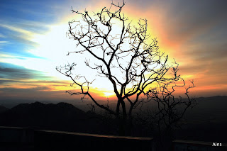 "The rising sun at dawn a sight to behold,the glow reflecting the beauty of Mount Abu"