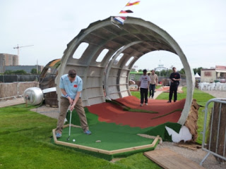 Playing the 'Golf Apocalypse' Mini Golf course at London's Pleasure Gardens, near Pontoon Dock Playing the 'Golf Apocalypse' Mini Golf course at London's Pleasure Gardens, near Pontoon Dock