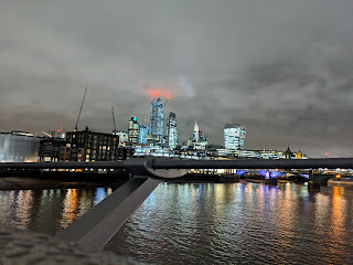 A view of The City at night from the Millenium Bridge