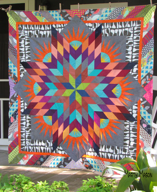 Summer Solstice quilt top with a border with Attitude