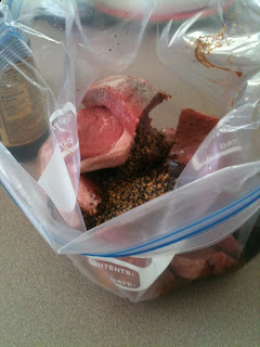 Chopped steak placed in a plastic bag to be seasoned.