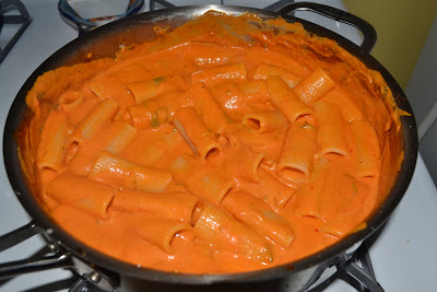 Toss pink vodka sauce with penne pasta.