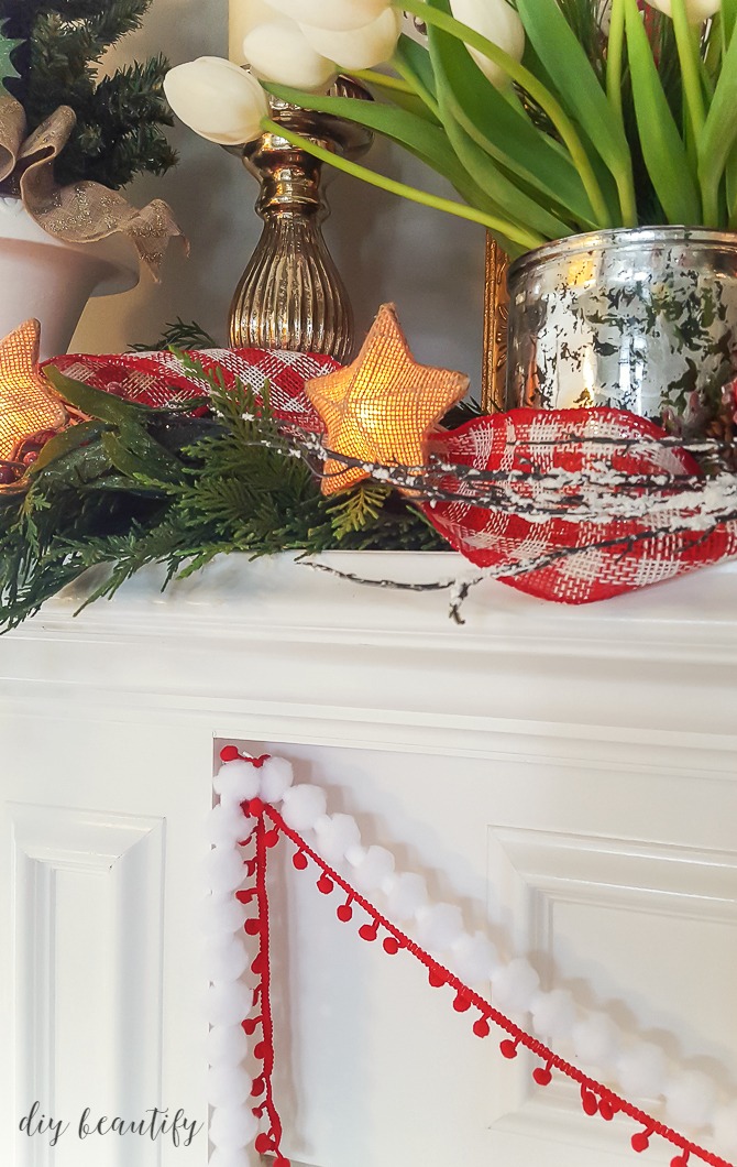 I'm sharing some tips for decorating a festive Christmas mantle sure to get you in the holiday spirit! See more at diy beautify!