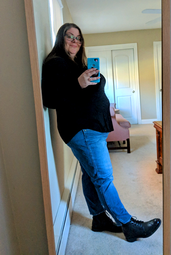 image of me standing in a full-length mirror, turned to the side, so my belly rolls are on full display