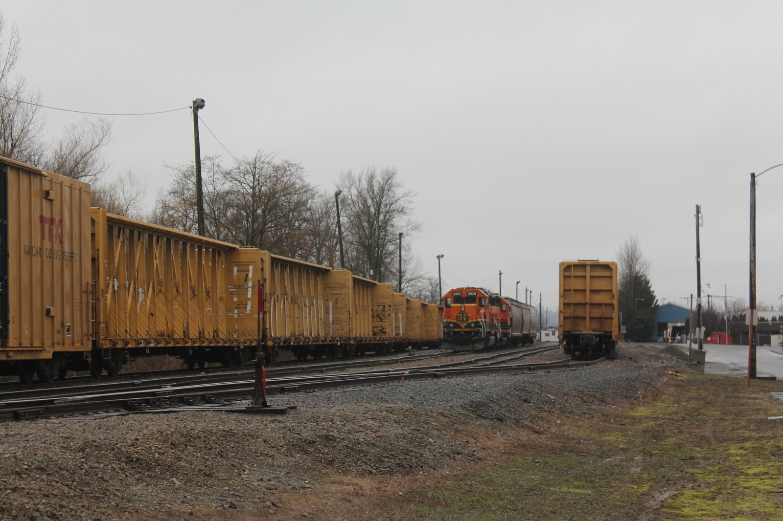 Railfan in Sumas, WA overcast, BNSF switchers 2100/GP382 and 2880