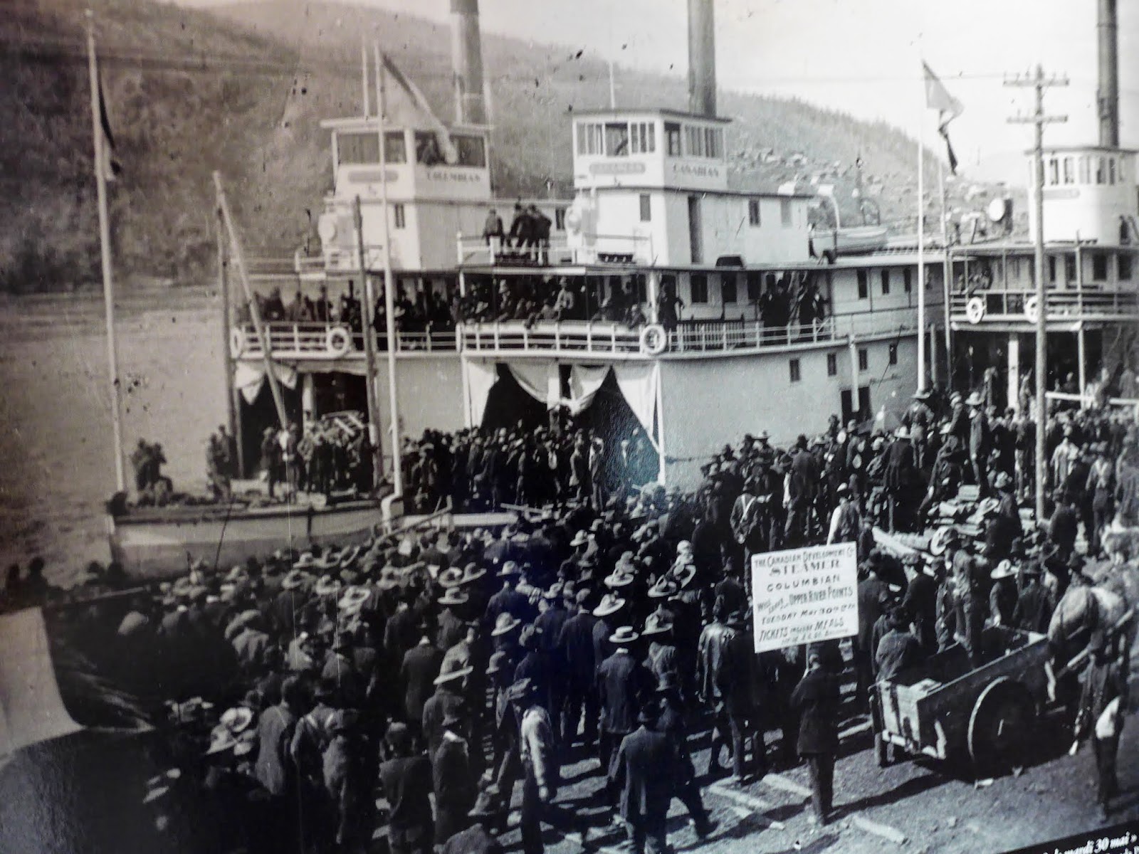 Old picture of people watching the ship arrive in the late 1800's