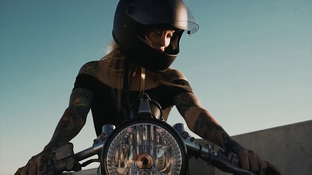 Torrie Blake aboard a Lime Bikes cafe racer motorcycle