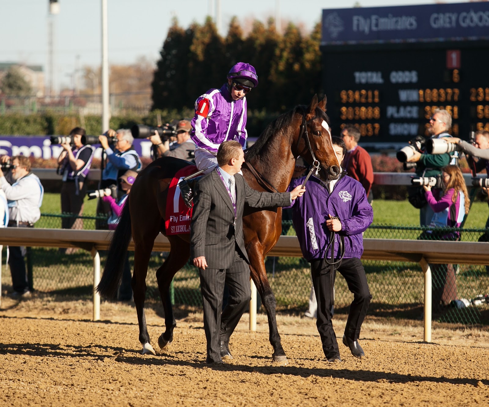 Past the Grandstand A Tall Jockey, a Magnificent Horse, and a Lily