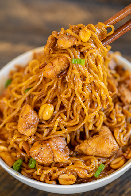 Spicy Sriracha Chicken Noodles - ready to eat in 15 minutes! No joke!!! SO easy!!! Only 6 ingredients - Chicken, ramen noodles, brown sugar, soy sauce, sriracha, and peanuts. Garnish with green onions. Great way to use up leftover chicken! Can add broccoli, green beans or asparagus. We ate this twice in one week. Everyone LOVES this easy noodle bowl!! #chicken #asian #ramen #noodles Spicy Sriracha Chicken Noodles - ready to eat in 15 minutes! No joke!!! SO easy!!! Only 6 ingredients - Chicken, ramen noodles, brown sugar, soy sauce, sriracha, and peanuts. Garnish with green onions. Great way to use up leftover chicken! Can add broccoli, green beans or asparagus. We ate this twice in one week. Everyone LOVES this easy noodle bowl!! #chicken #asian #ramen #noodles