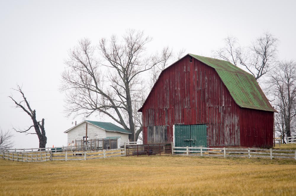 Red barn with green roof Photography In Place
