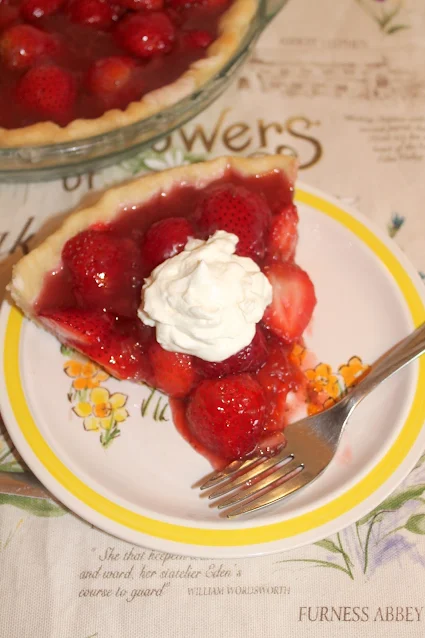 Fresh Strawberry Pie with a slice on a plate.