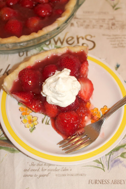 Strawberry season is the perfect time to make this fresh strawberry pie! Fresh Strawberry Pie with a slice on a plate.
