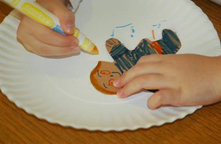 decorating gingerbread boys and girls for garland