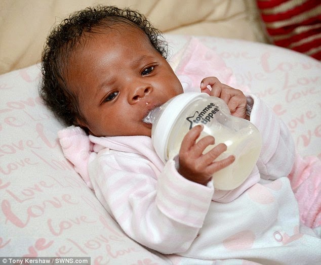 3days old nigerian baby feeding herself