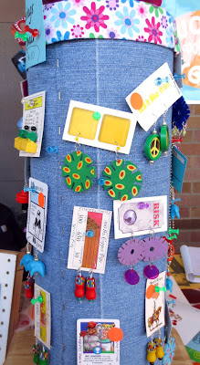DIsplay of upcycled earrings made from game pieces