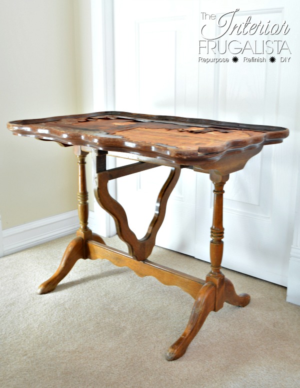 An antique scalloped tilt-top table before getting a makeover.