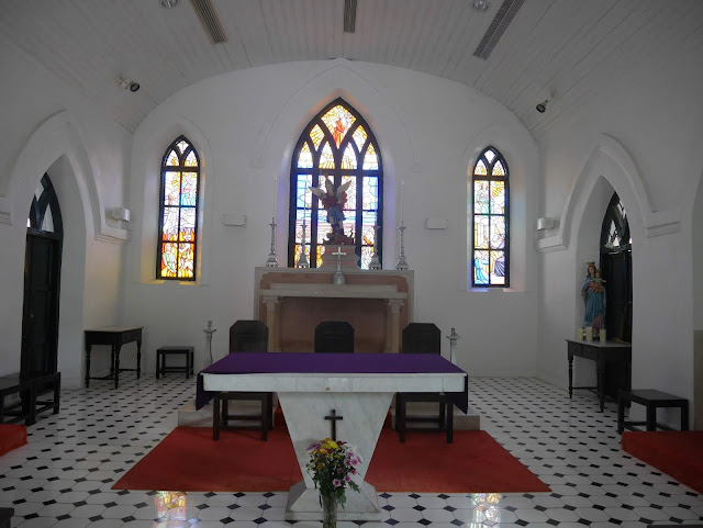 altar and stained glass inside Macau's St. Michael Archangel Chapel