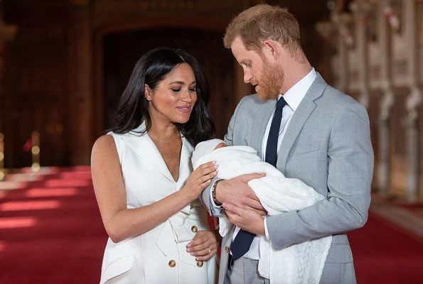 Meghan Markle wore a bespoke cream trench-style dress designed by British fashion designer Grace Wales Bonner