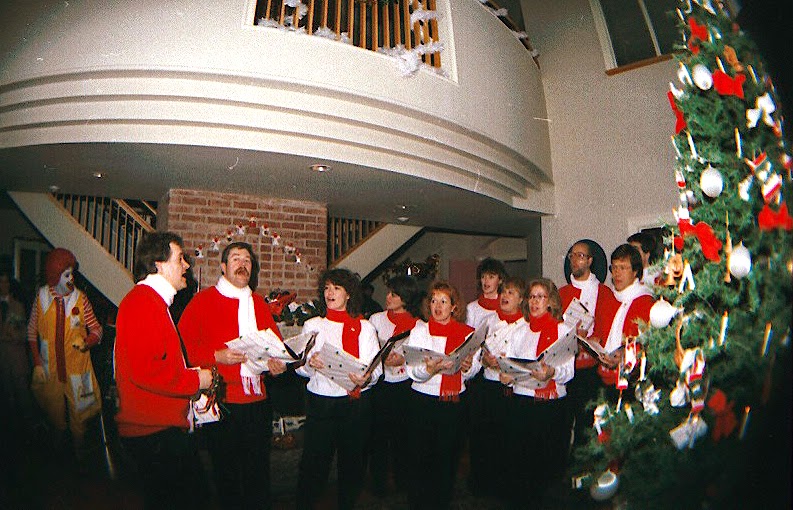 The Stairwell Carollers sing Christmas carols at Ronald McDonald House 1986