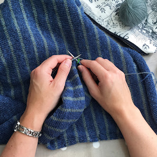 Knitting on my hand-knit sweater