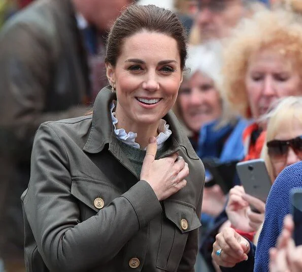 Kate Middleton is wearing chunky boots by Chloe, and a jacket by Troy of London, Kiki McDonough gold diamond earrings