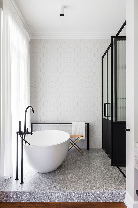 Contemporary bathroom with two levels by Arent & Pyke. Photo by Tom Ferguson