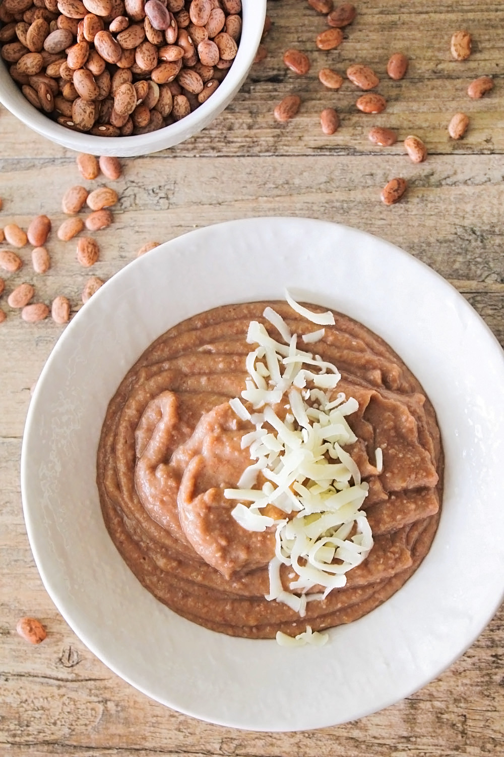 These delicious Instant Pot pinto beans are so easy to make, and make amazing refried beans too!