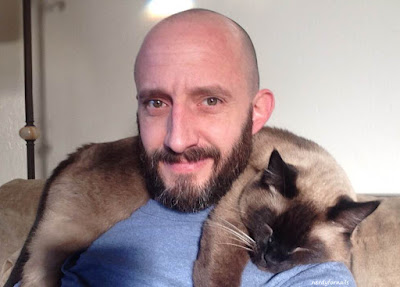 Guy with a siamese