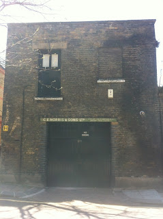 Old sign on a garage in Whidbourne Street, King's Cross, London, WC1