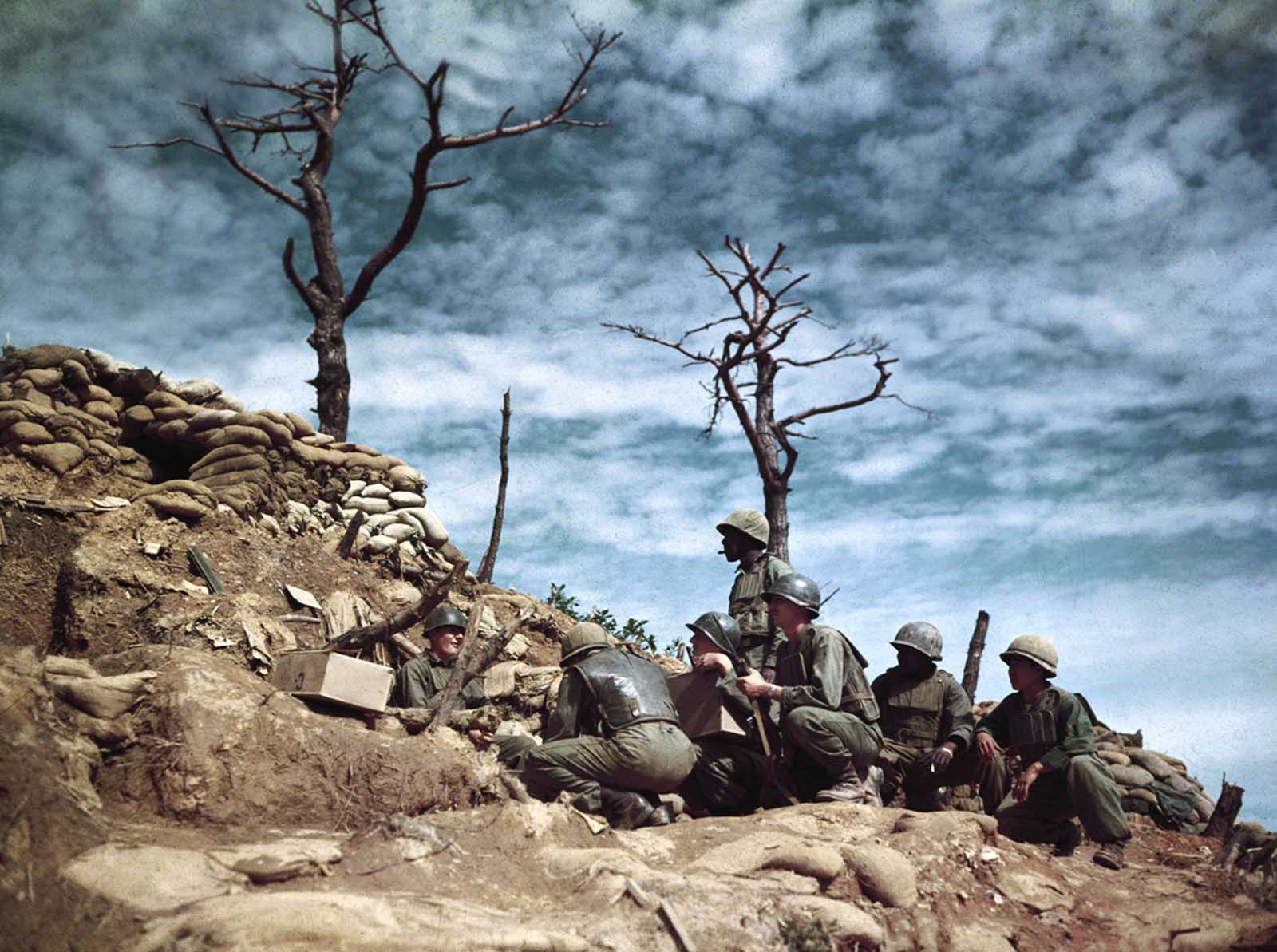 Soldiers digging into bunkers atop Old Baldy in Korea in 1952.