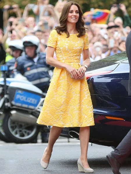 The Duchess wore Jenny Packham Yellow Dress for Heidelberg visit. Kate's wearing her Monsoon Fleur wedges