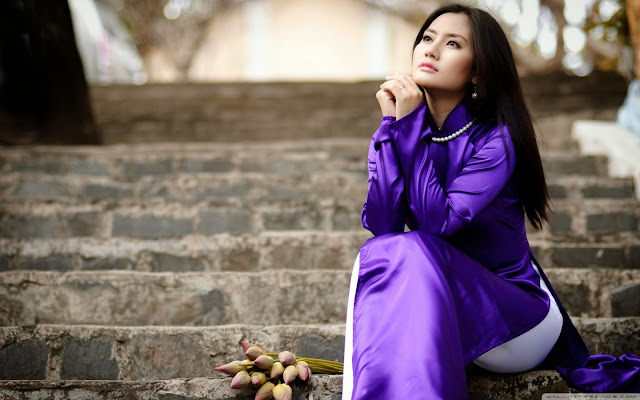 Girl Thinking In Purple Dress On Strairs