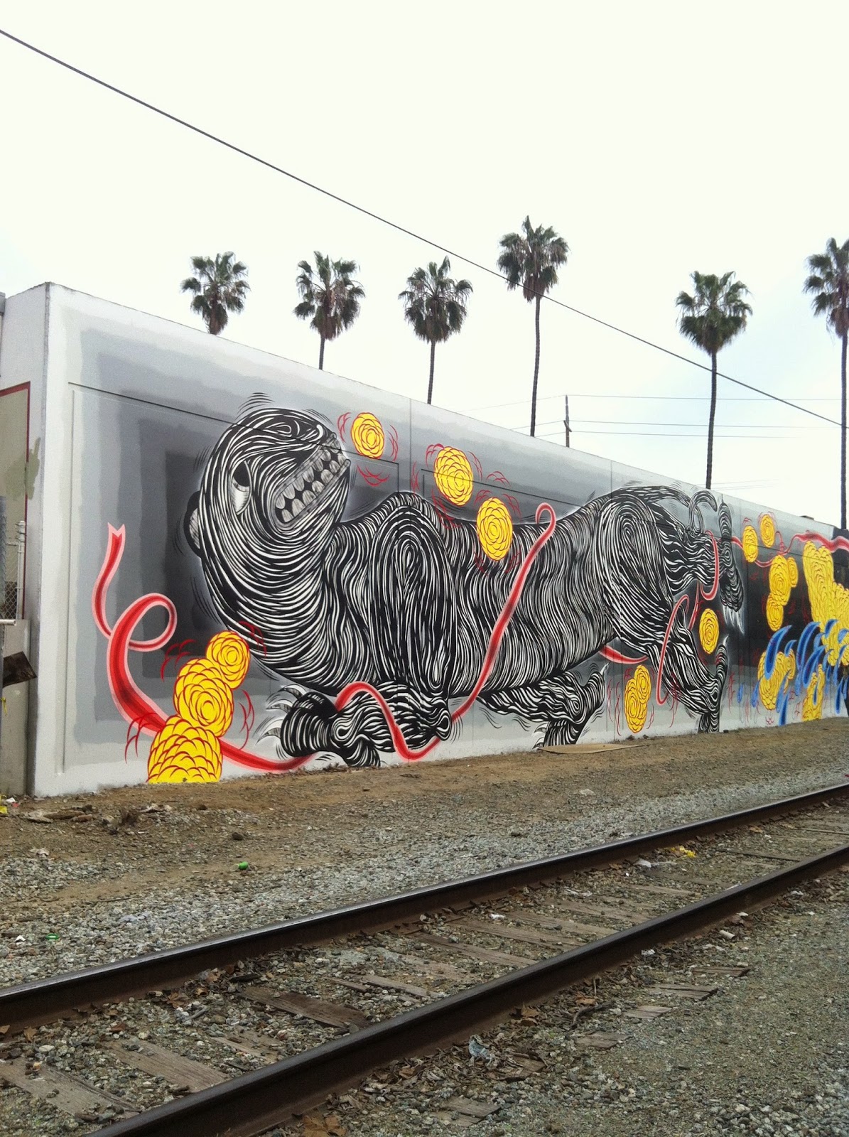 Andrew Schoultz is currently in Santa Fe, California where he just finished working on this beasty mural.